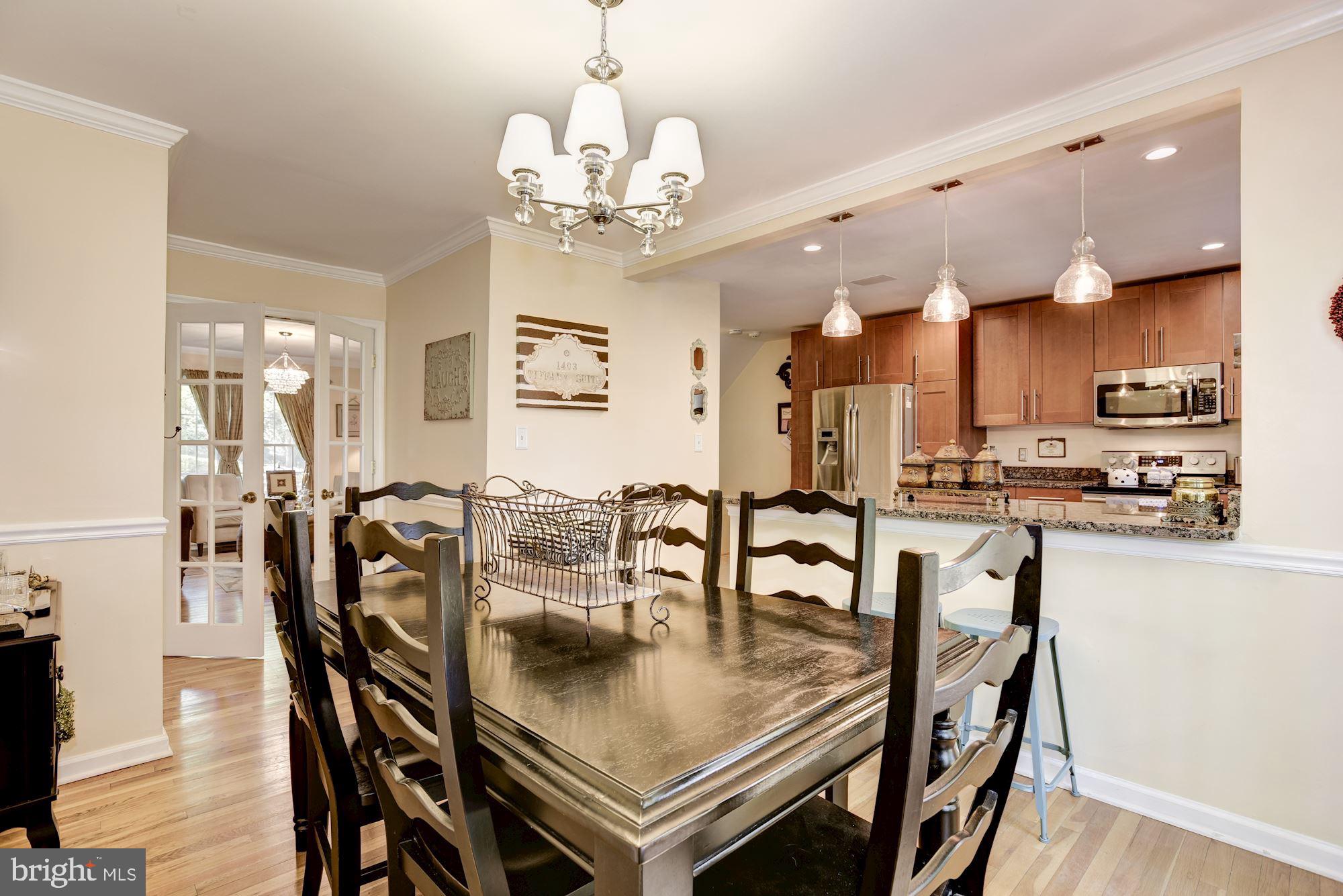 1851 Wainwright Drive Reston, VA 20190 - Photo 7 of 26 a view of a dining room with furniture and wooden floor