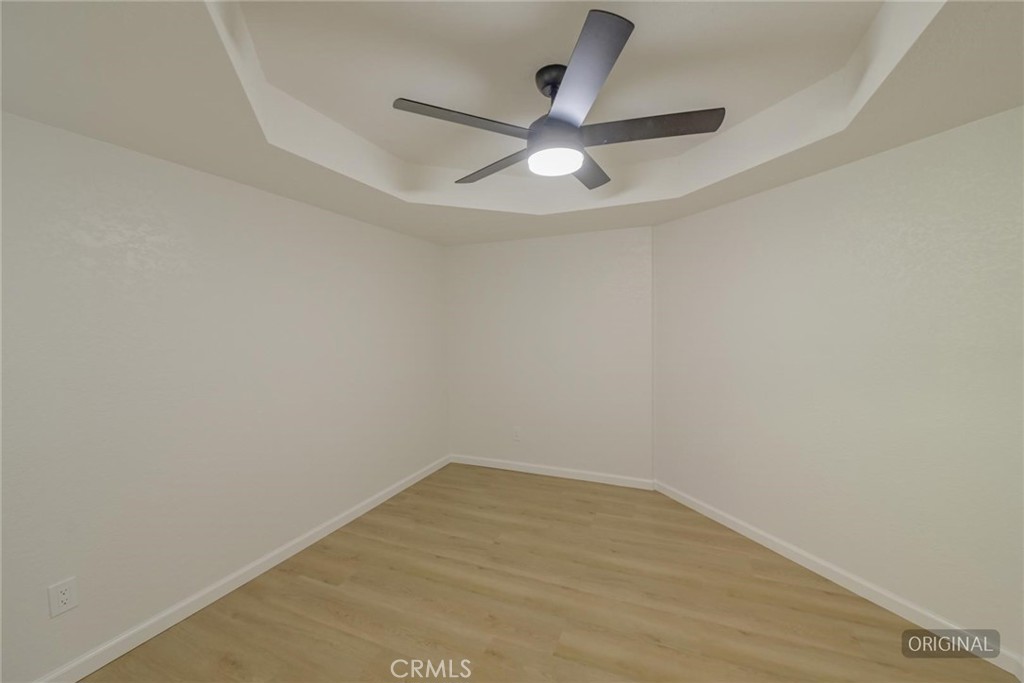 18515 Kalin Ranch Drive Victorville, CA 92395 - Photo 12 of 33 a view of a big room with wooden floor