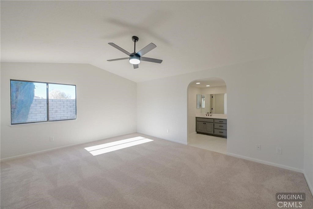 18515 Kalin Ranch Drive Victorville, CA 92395 - Photo 14 of 33 an empty room with windows and cabinet