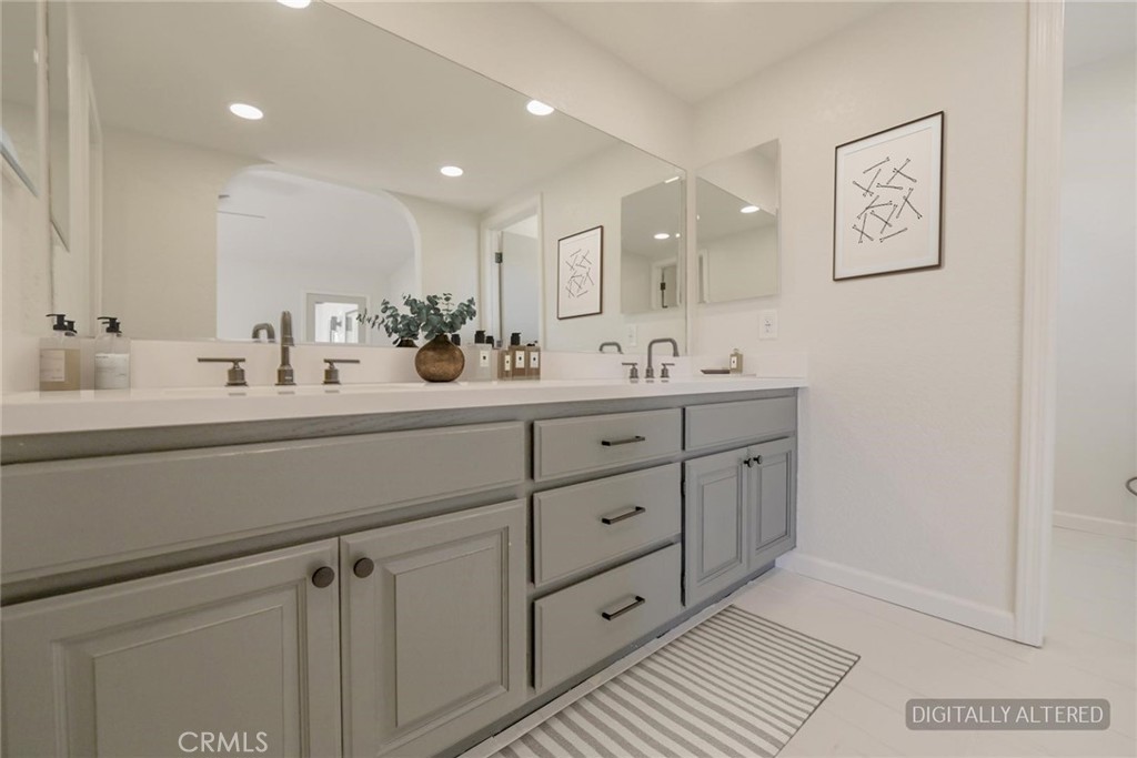 18515 Kalin Ranch Drive Victorville, CA 92395 - Photo 15 of 33 a bathroom with a double vanity sink and mirror
