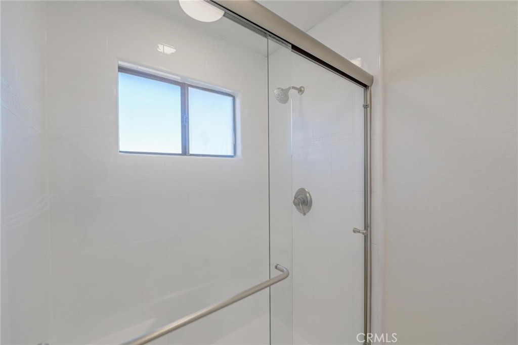 18515 Kalin Ranch Drive Victorville, CA 92395 - Photo 17 of 33 a bathroom with a shower and a window