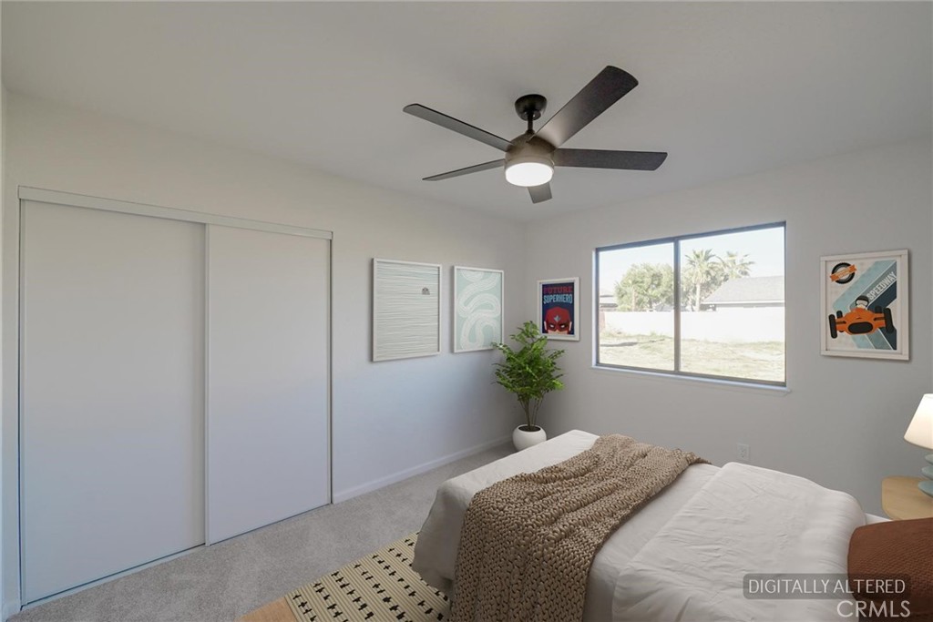 18515 Kalin Ranch Drive Victorville, CA 92395 - Photo 19 of 33 a bedroom with a large bed and a window