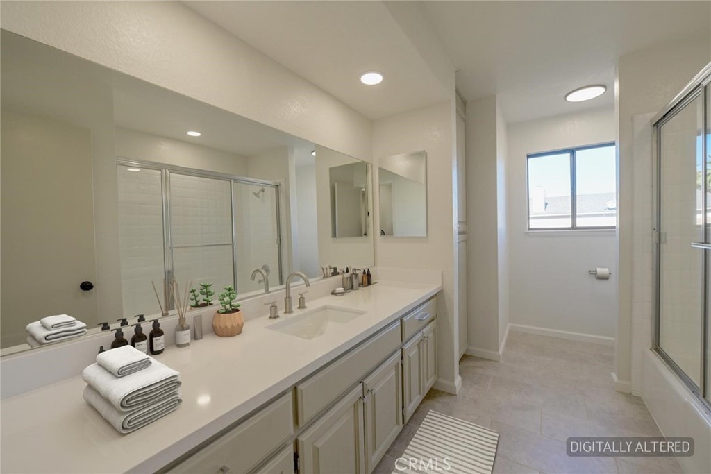 18515 Kalin Ranch Drive Victorville, CA 92395 - Photo 21 of 33 a bathroom with double vanity sinks double vanity and a mirror