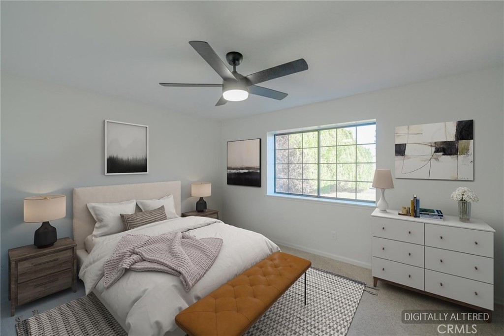 18515 Kalin Ranch Drive Victorville, CA 92395 - Photo 23 of 33 a bedroom with a large bed and a window