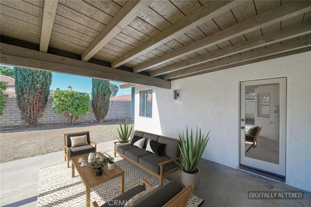 18515 Kalin Ranch Drive Victorville, CA 92395 - Photo 27 of 33 a view of a livingroom with furniture and a table