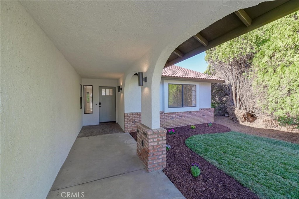 18515 Kalin Ranch Drive Victorville, CA 92395 - Photo 3 of 33 a view of a house with a yard
