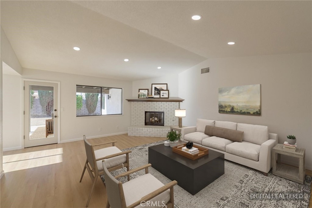 18515 Kalin Ranch Drive Victorville, CA 92395 - Photo 4 of 33 a living room with furniture and a wooden floor