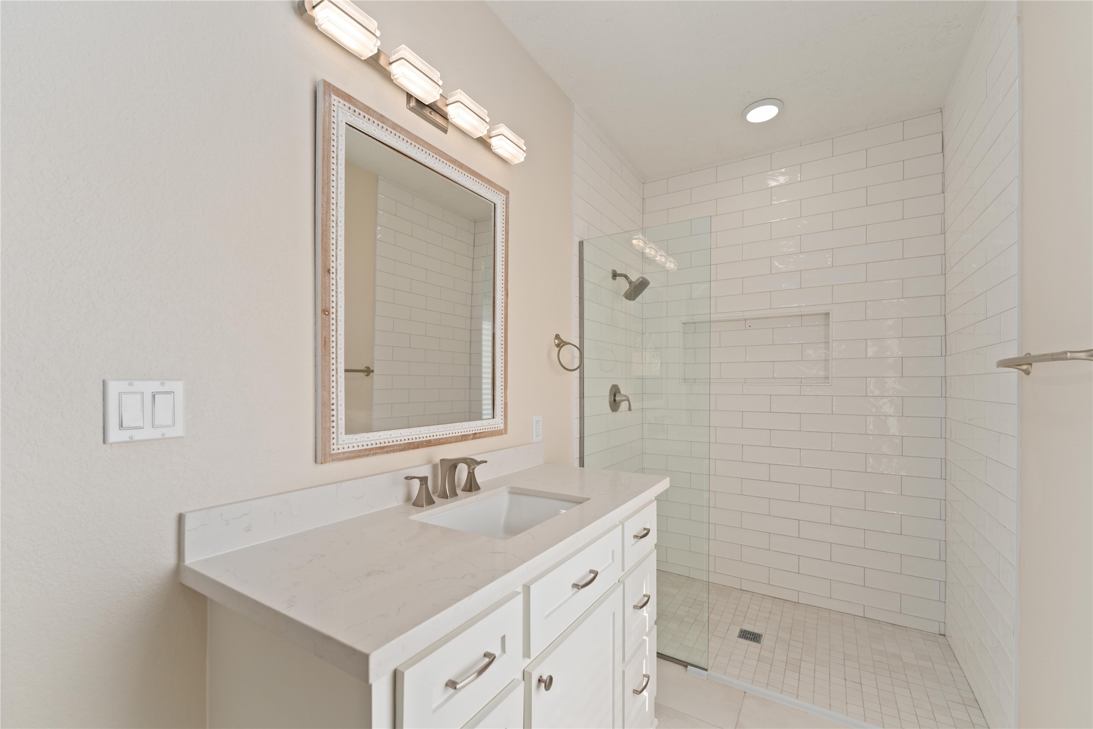 2631 Persa Street Houston, TX 77098 - Photo 14 of 25 a bathroom with a sink a toilet and shower