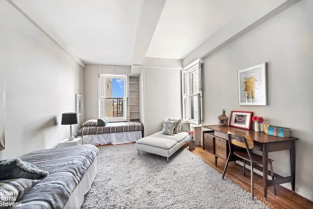 a bathroom with a toilet a sink and a mirror