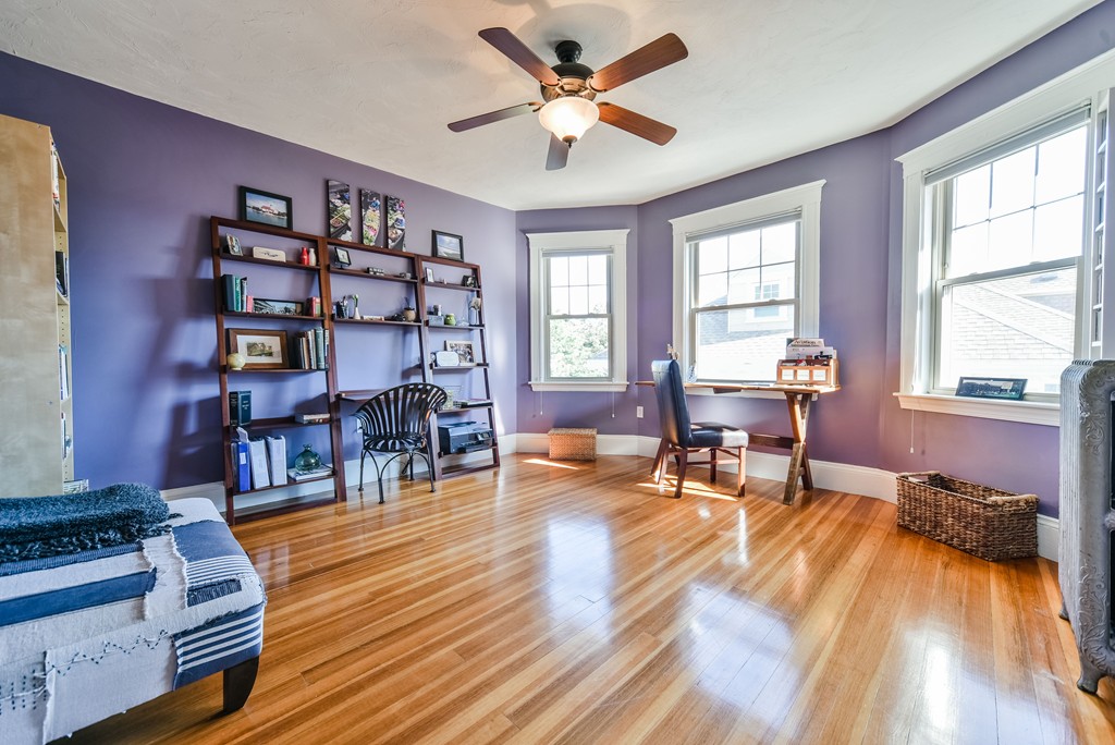 99 Parkton Road, Unit 2 Boston, MA 02130 - Photo 12 of 19 a living room with furniture a dining table and wooden floor