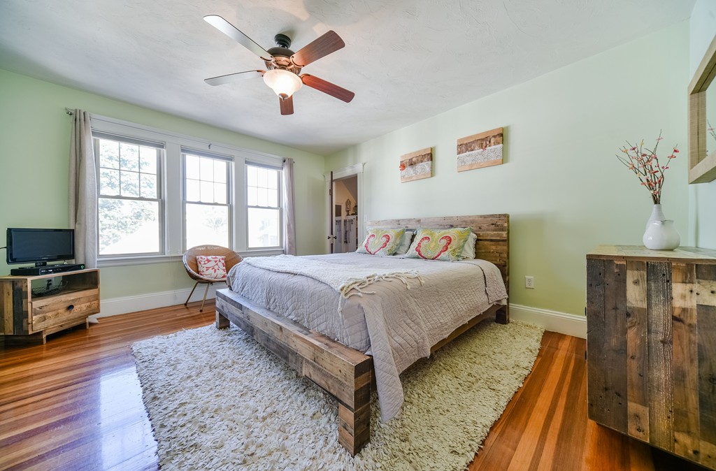 99 Parkton Road, Unit 2 Boston, MA 02130 - Photo 13 of 19 a spacious bedroom with a bed and a flat screen tv