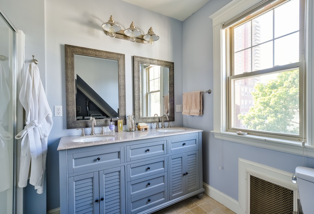 99 Parkton Road, Unit 2 Boston, MA 02130 - Photo 15 of 19 a bathroom with a double vanity sink a mirror and a window