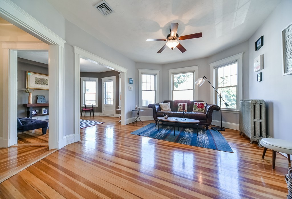99 Parkton Road, Unit 2 Boston, MA 02130 - Photo 2 of 19 a living room with furniture and a wooden floor