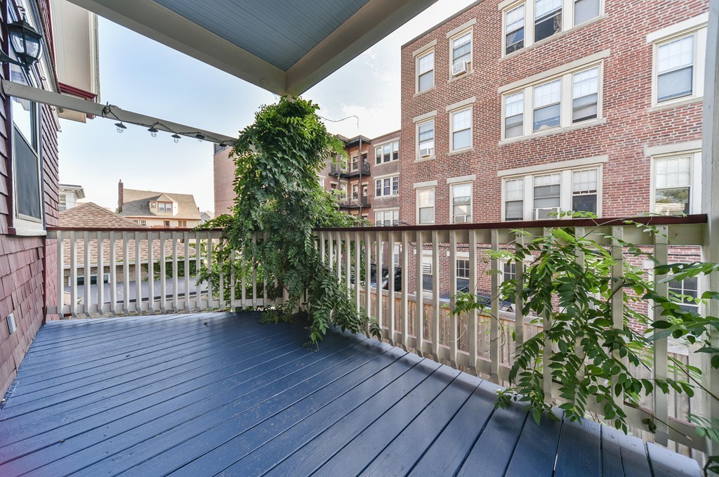 99 Parkton Road, Unit 2 Boston, MA 02130 - Photo 6 of 19 a view of a balcony with wooden floor