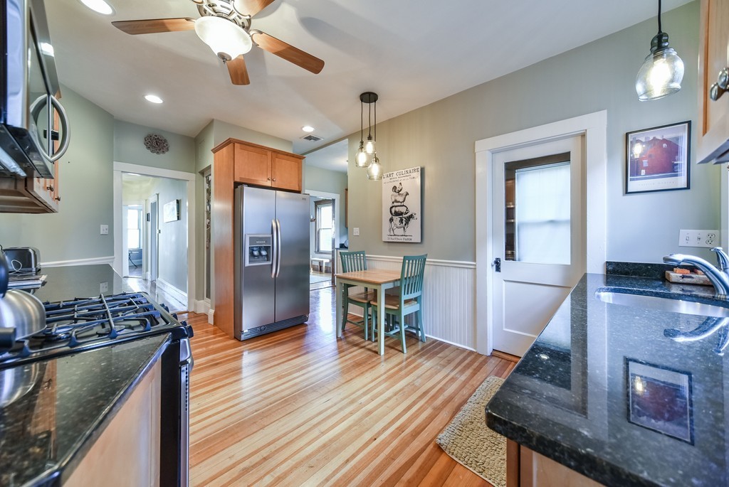 99 Parkton Road, Unit 2 Boston, MA 02130 - Photo 8 of 19 a kitchen with stainless steel appliances granite countertop a refrigerator stove and oven