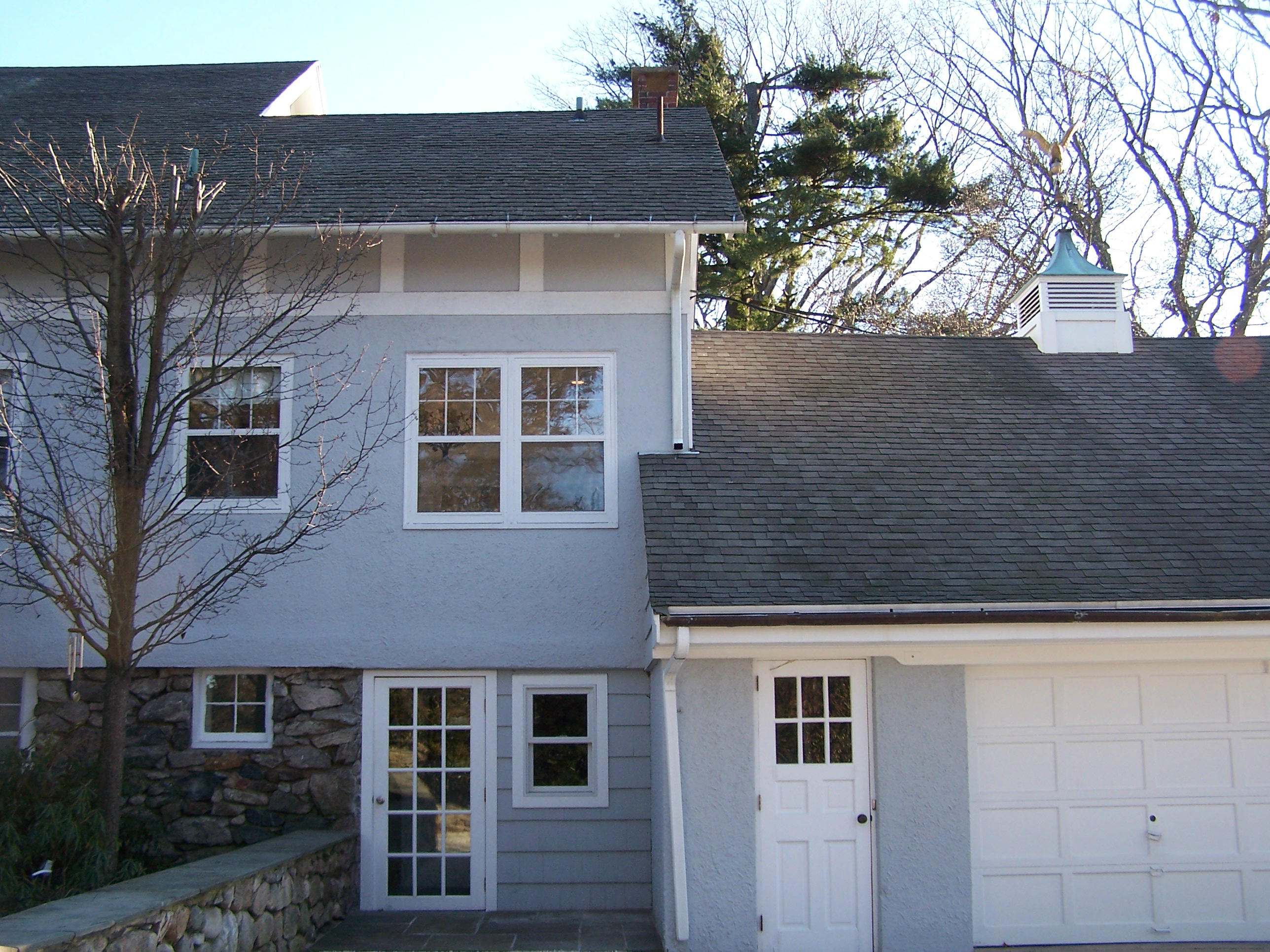 9 Contentment Island Road Darien, CT 06820 - Photo 11 of 38 a front view of a house with a yard