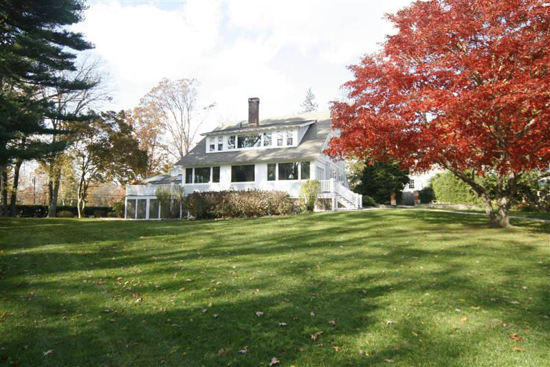 9 Contentment Island Road Darien, CT 06820 - Photo 15 of 38 a front view of a house with a garden
