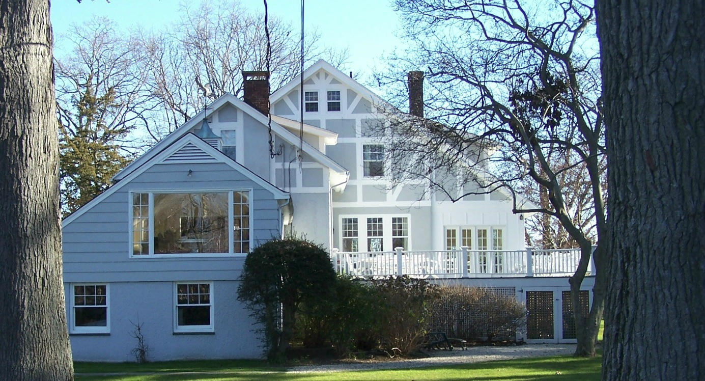9 Contentment Island Road Darien, CT 06820 - Photo 17 of 38 a front view of a house with a yard