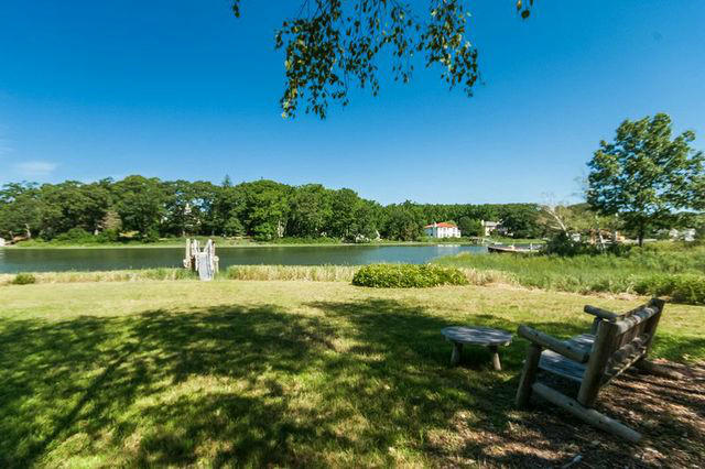 9 Contentment Island Road Darien, CT 06820 - Photo 2 of 38 a view of a lake with houses in the back