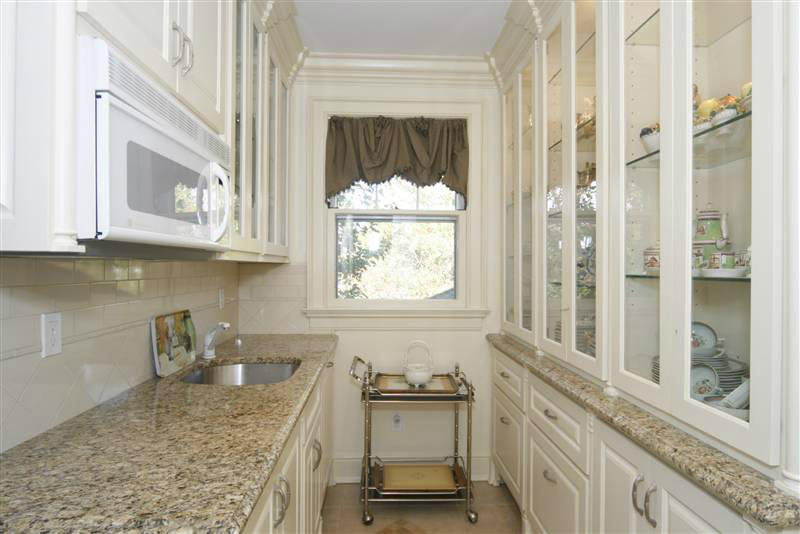 9 Contentment Island Road Darien, CT 06820 - Photo 27 of 38 a kitchen with stainless steel appliances granite countertop a stove a sink and a microwave