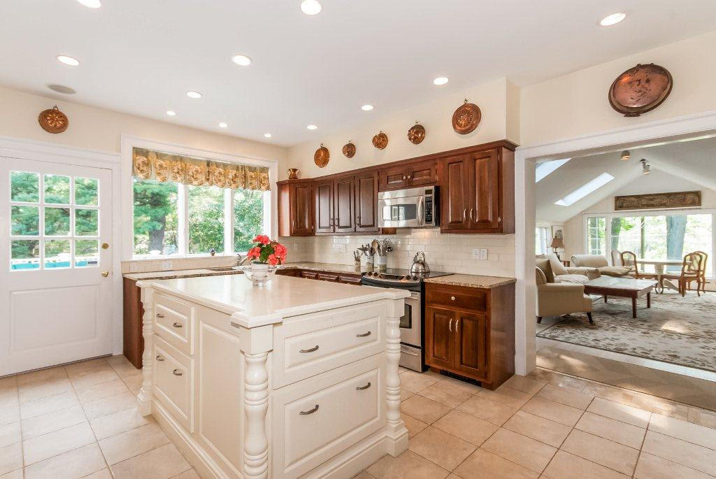 9 Contentment Island Road Darien, CT 06820 - Photo 30 of 38 a kitchen with stainless steel appliances granite countertop a sink and a stove