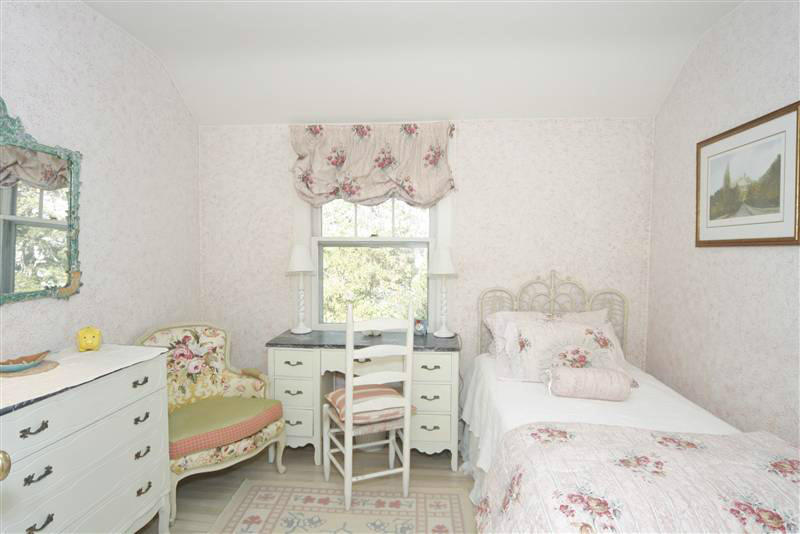 9 Contentment Island Road Darien, CT 06820 - Photo 36 of 38 a bedroom with a bed and a window