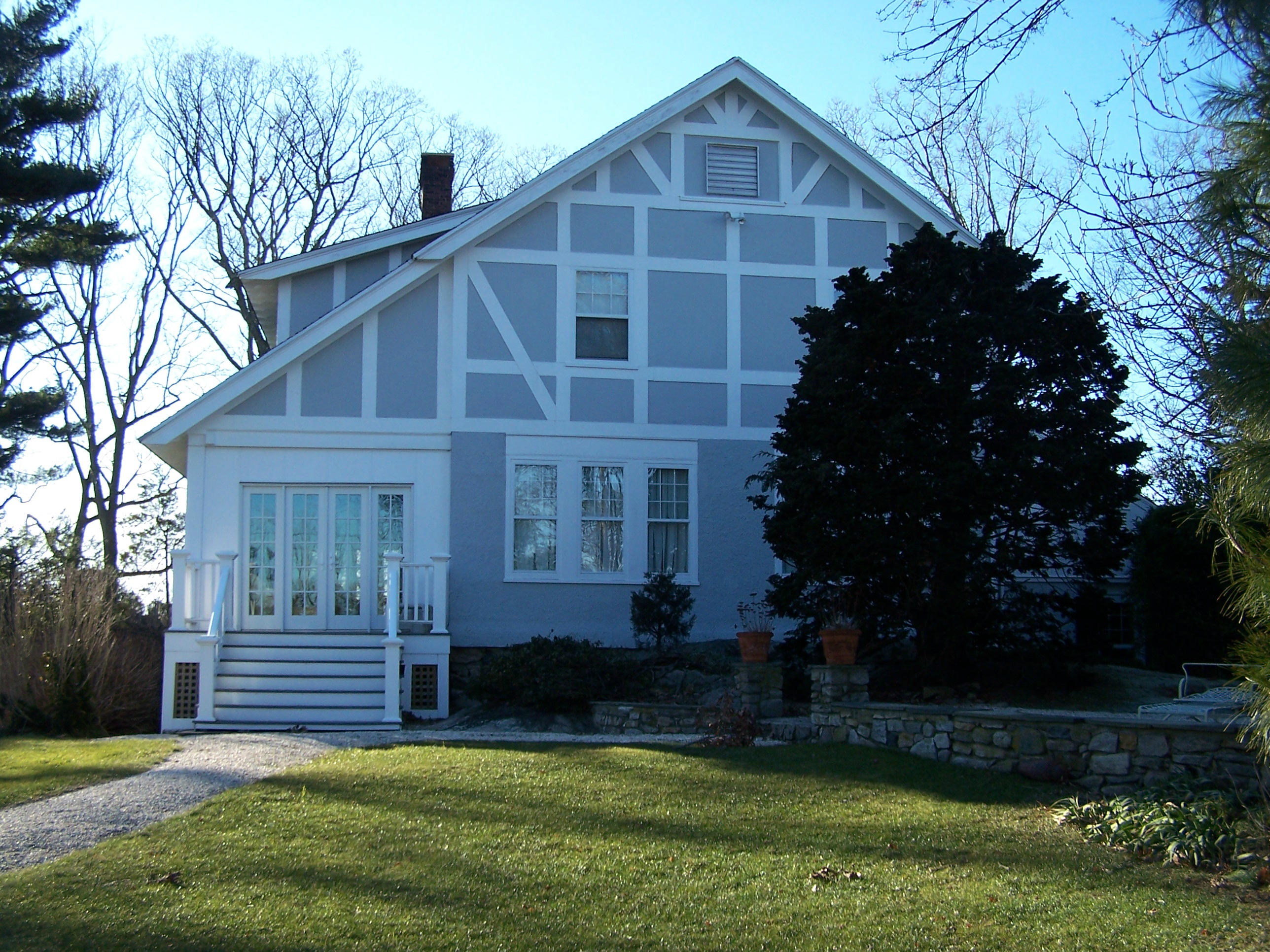 9 Contentment Island Road Darien, CT 06820 - Photo 4 of 38 a front view of a house with a yard