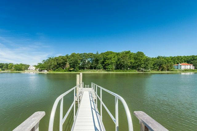 9 Contentment Island Road Darien, CT 06820 - Photo 6 of 38 a view of a lake from a balcony