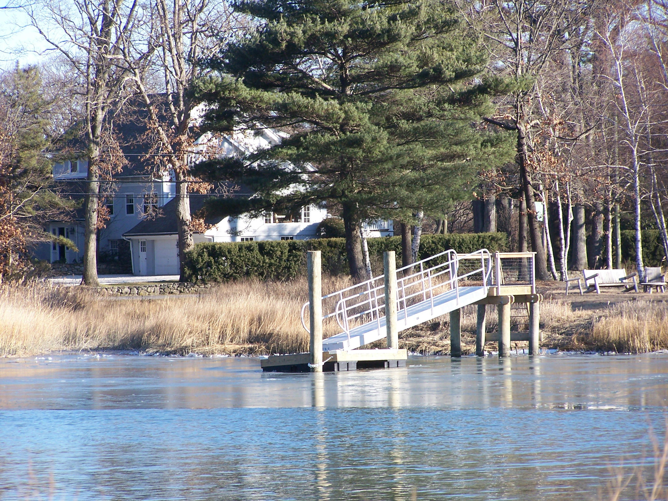 9 Contentment Island Road Darien, CT 06820 - Photo 10 of 38 a view of a swimming pool with seating space