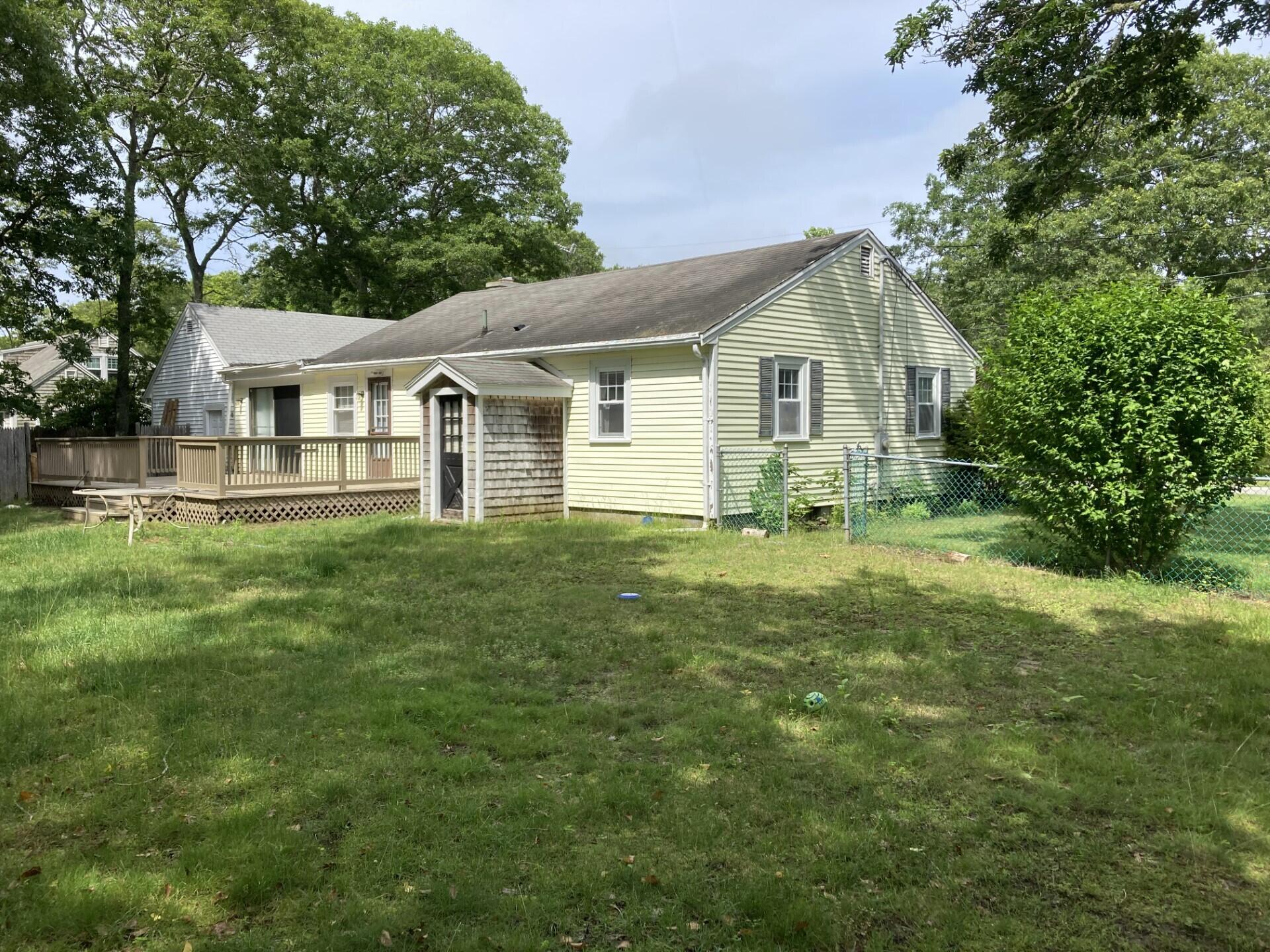 45 Blue Jay Drive Hyannis, MA 02601 - Photo 5 of 18 a front view of house with yard and green space
