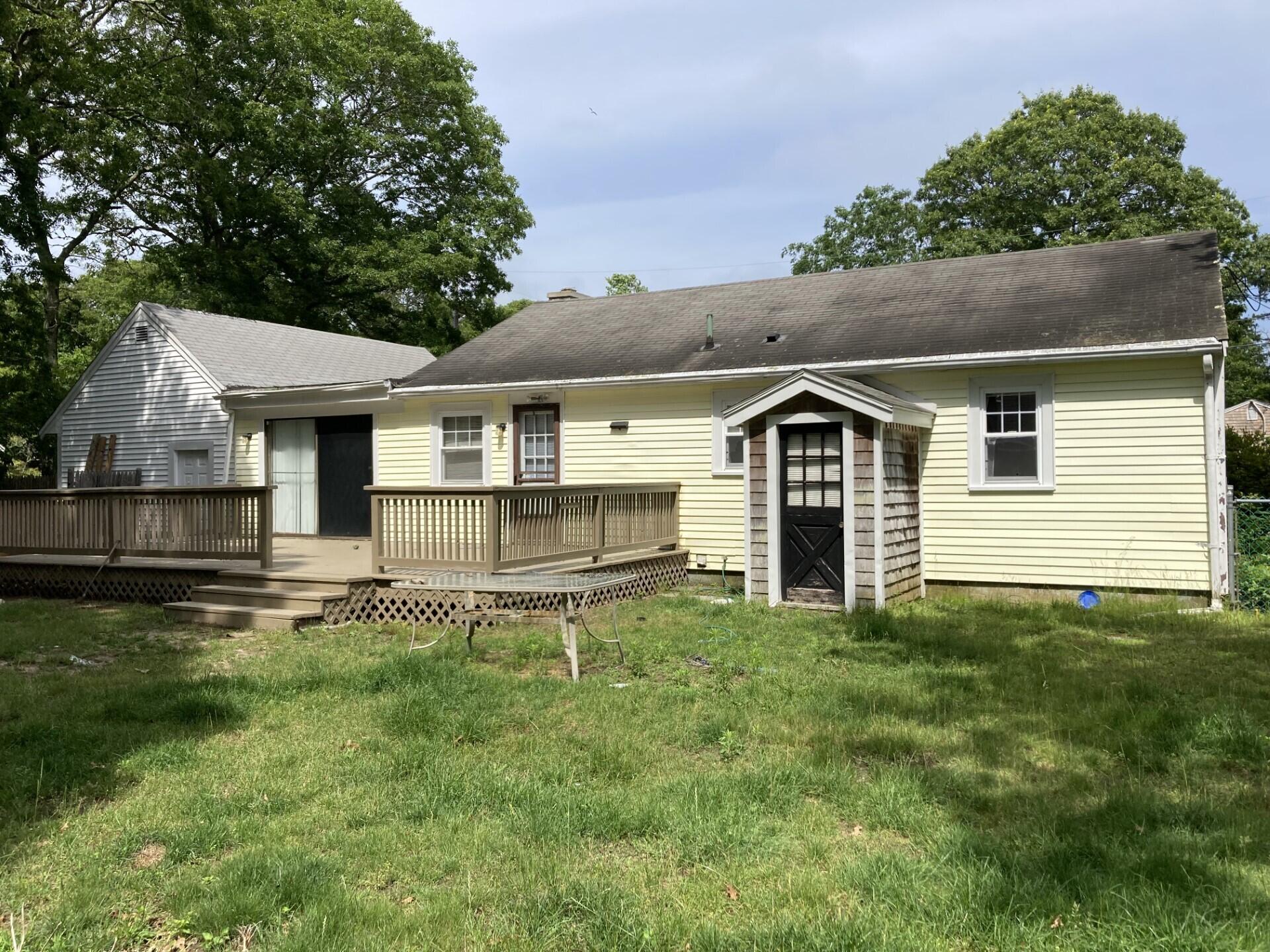 45 Blue Jay Drive Hyannis, MA 02601 - Photo 6 of 18 a front view of a house with a yard