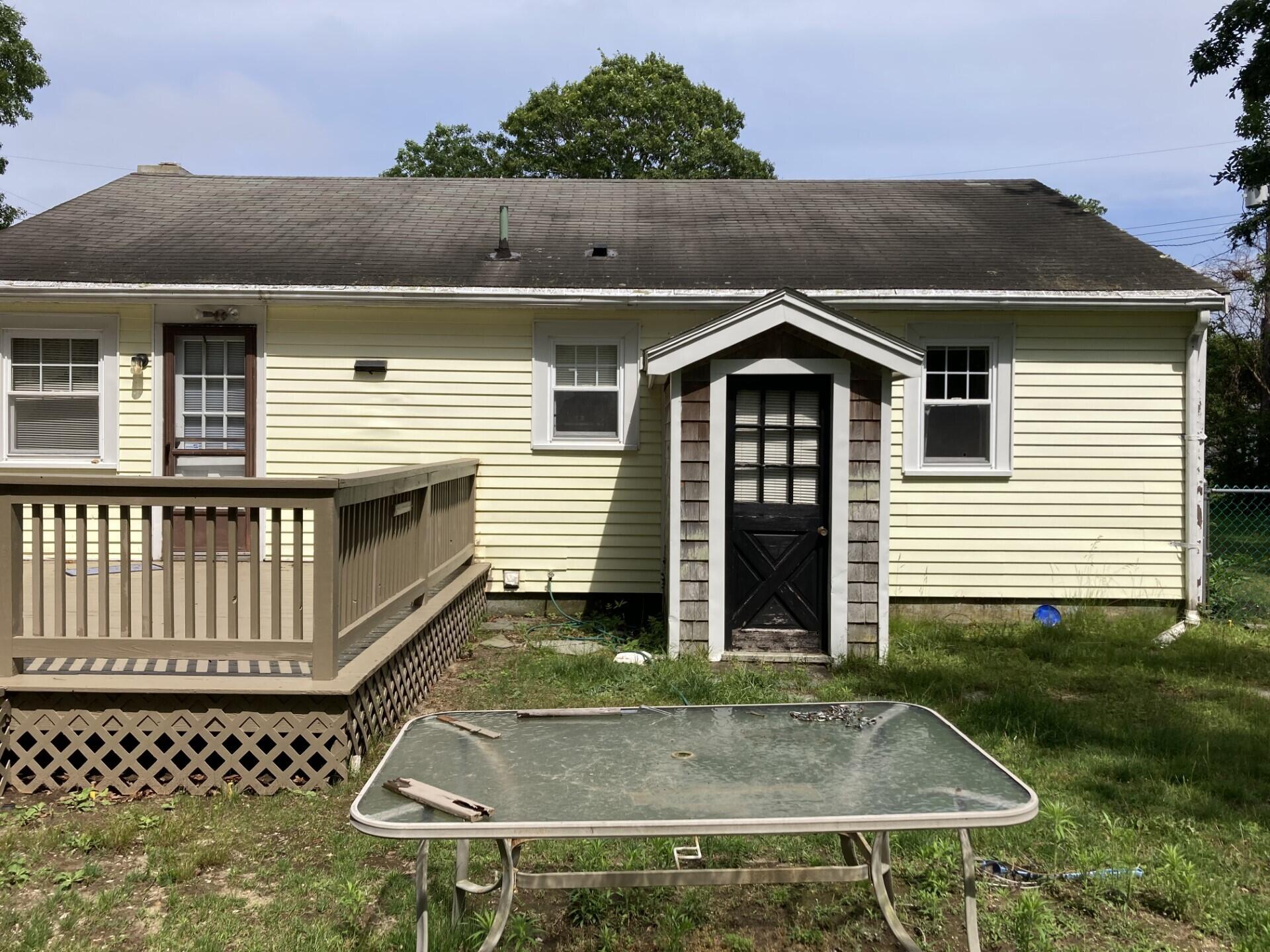 45 Blue Jay Drive Hyannis, MA 02601 - Photo 7 of 18 front view of a house with a porch