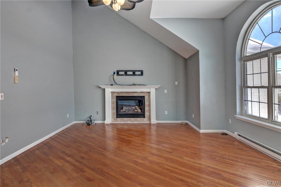 1095 Clover Road South Long Pond, PA 18334 - Photo 11 of 27 an empty room with windows and fireplace