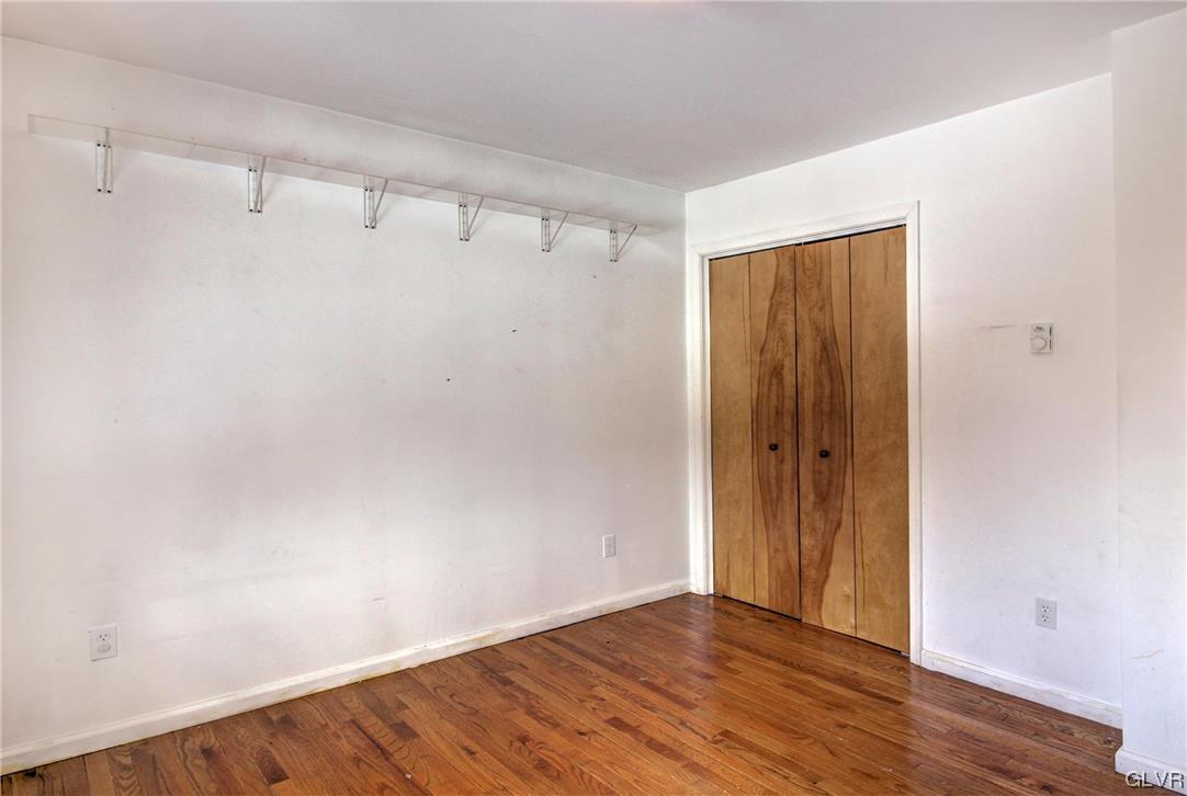 1095 Clover Road South Long Pond, PA 18334 - Photo 13 of 27 a view of an empty room with wooden floor and closet