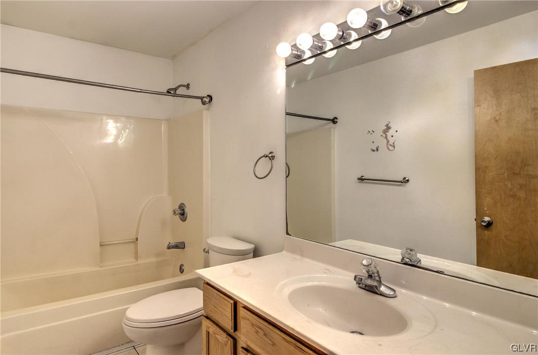 1095 Clover Road South Long Pond, PA 18334 - Photo 17 of 27 a bathroom with a sink toilet tub and shower