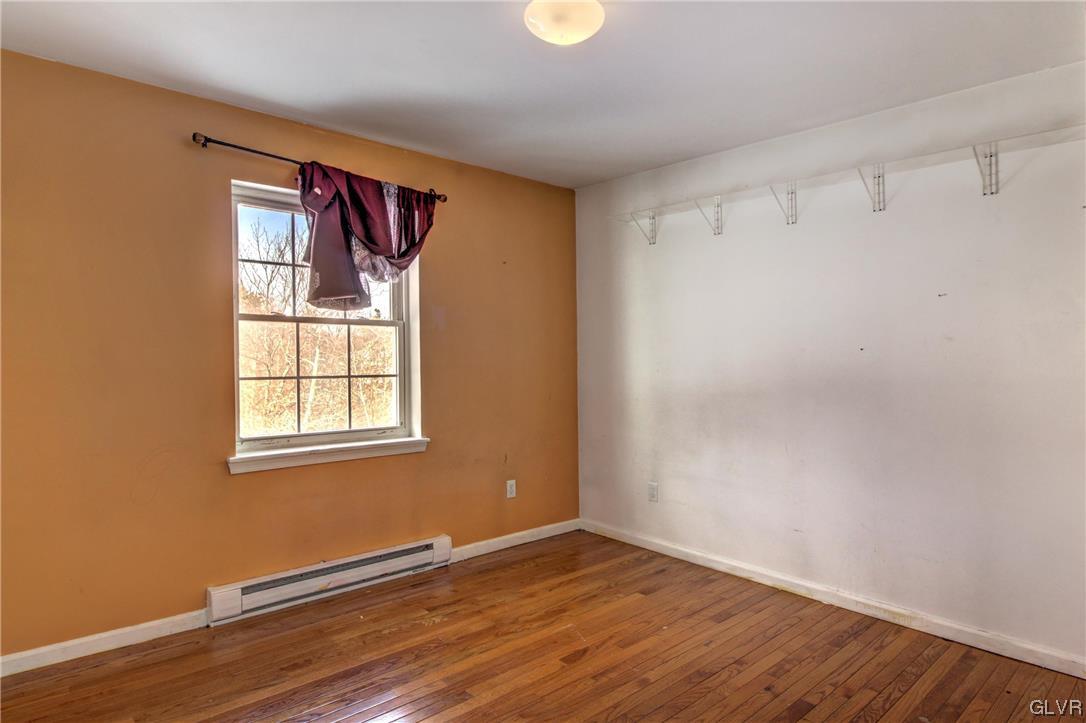1095 Clover Road South Long Pond, PA 18334 - Photo 18 of 27 a view of an empty room with wooden floor and a window