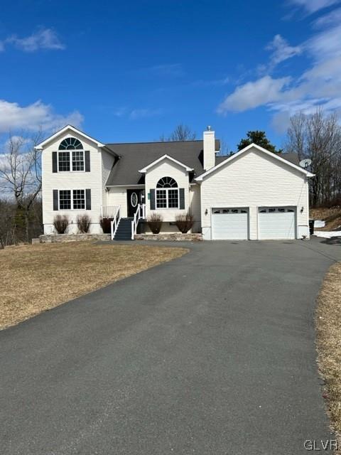 1095 Clover Road South Long Pond, PA 18334 - Photo 2 of 27 a front view of a house with a yard