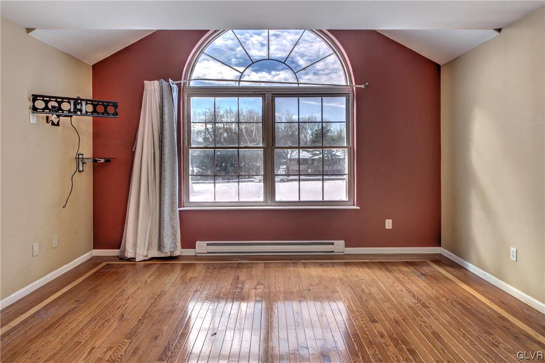 1095 Clover Road South Long Pond, PA 18334 - Photo 22 of 27 an empty room with wooden floor and windows