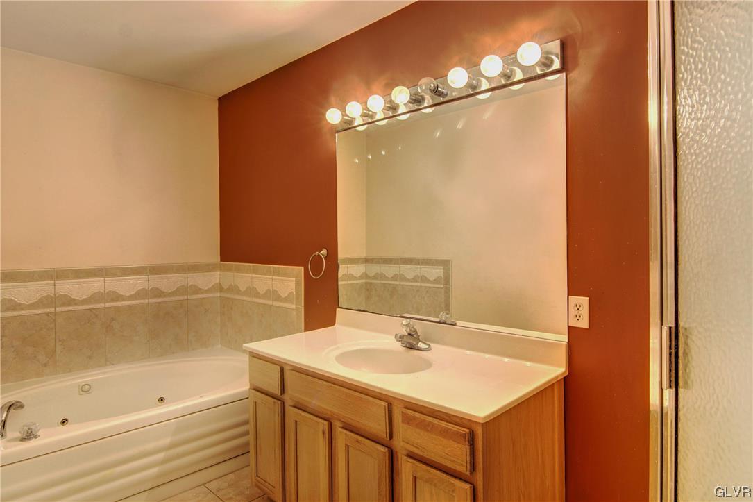 1095 Clover Road South Long Pond, PA 18334 - Photo 23 of 27 a bathroom with a sink and a mirror