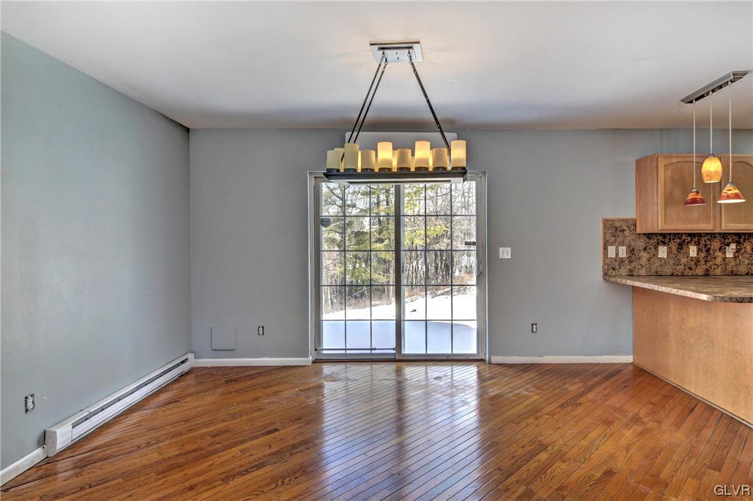 1095 Clover Road South Long Pond, PA 18334 - Photo 8 of 27 a view of an empty room with window and wooden floor