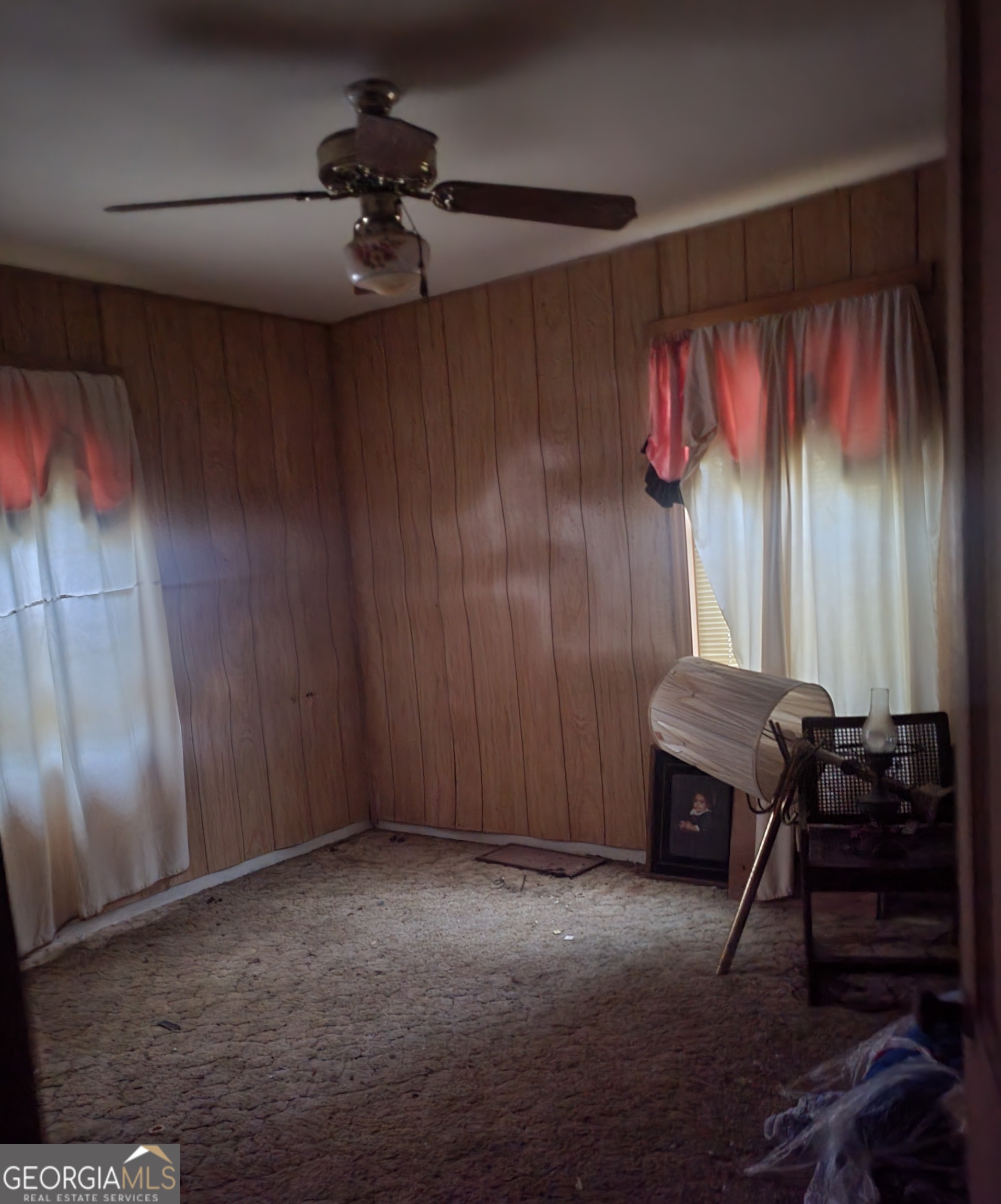 205 Collins Street Albany, GA 31705 - Photo 11 of 14 a view of a livingroom with furniture and a ceiling fan
