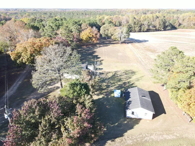 a view of backyard with patio