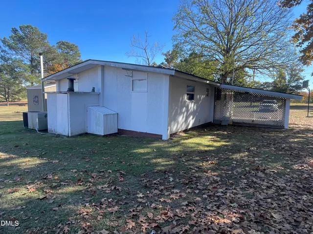 a kitchen with a sink a stove and cabinets