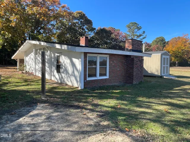 a kitchen with a sink a stove and a microwave