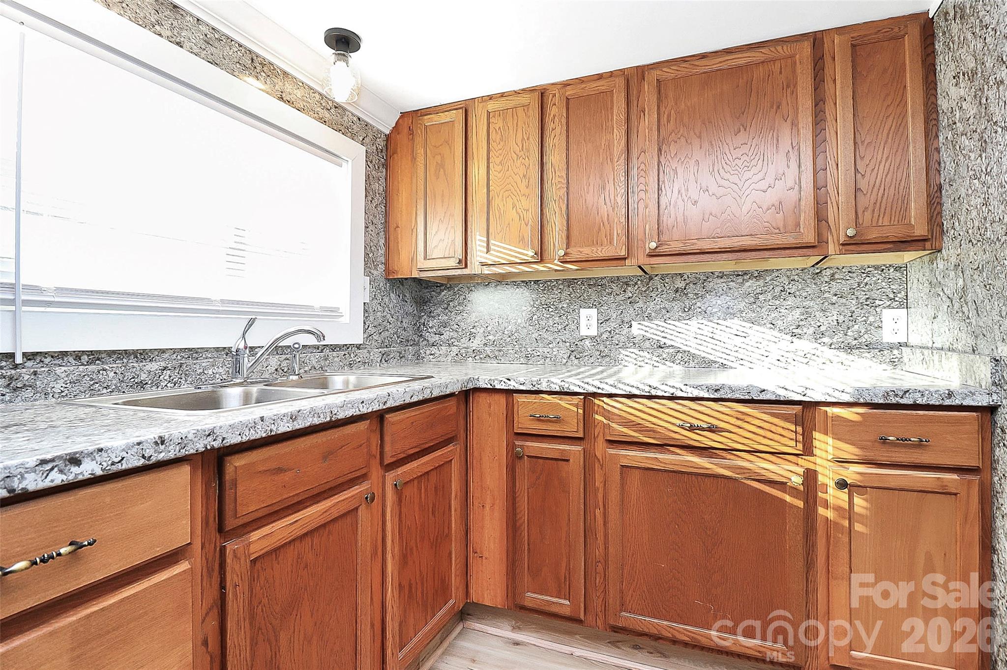 146 Swink Street Southwest Concord, NC 28027 - Photo 11 of 35 a kitchen with stainless steel appliances granite countertop wooden cabinets a sink and dishwasher