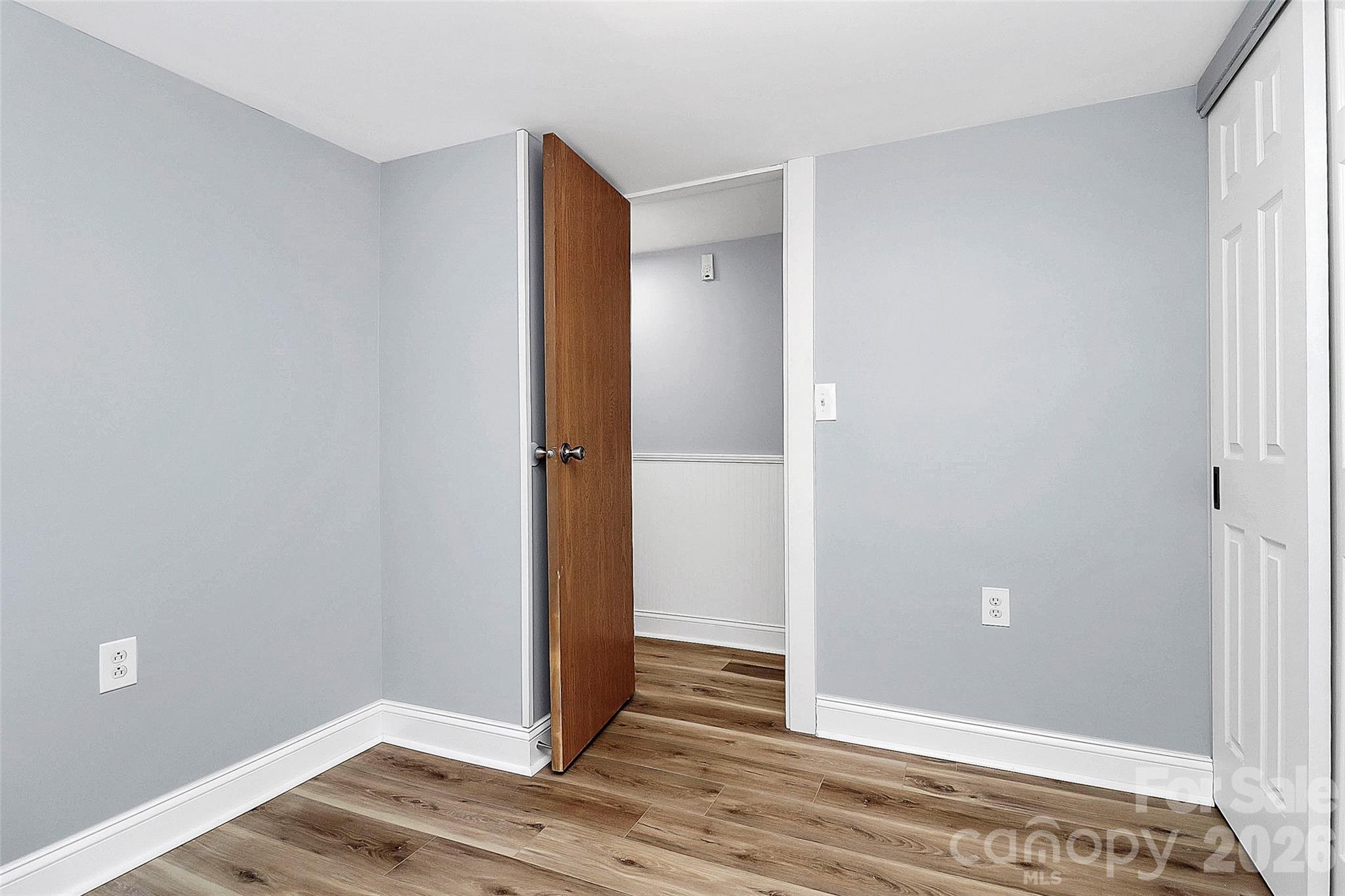 146 Swink Street Southwest Concord, NC 28027 - Photo 16 of 35 a view of entryway with wooden floor