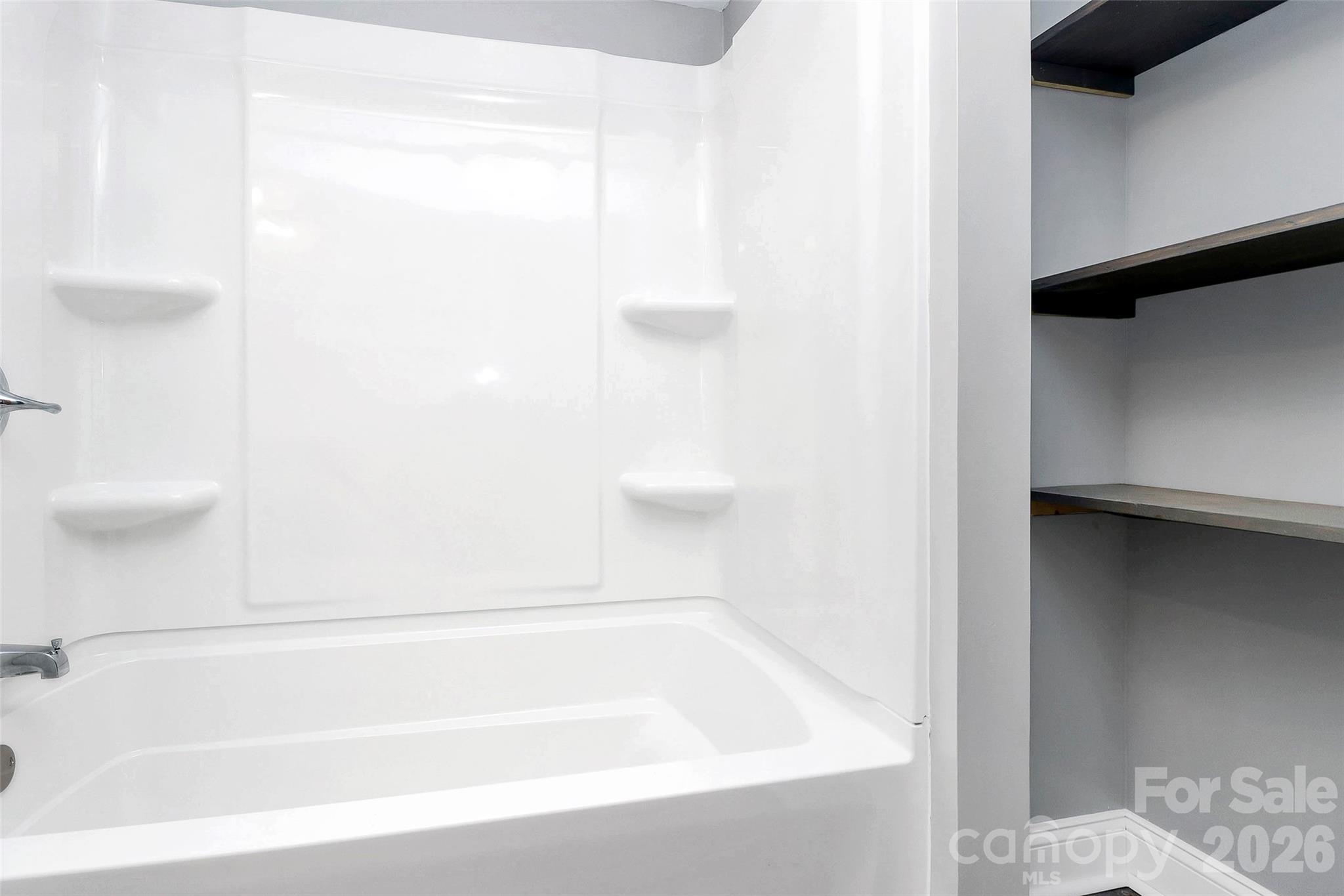 146 Swink Street Southwest Concord, NC 28027 - Photo 19 of 35 a bathroom with a bathtub