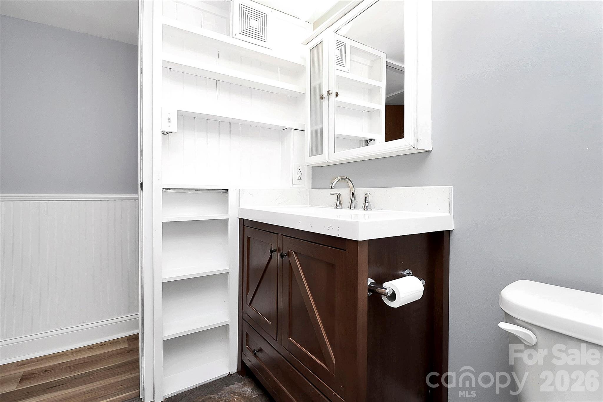 146 Swink Street Southwest Concord, NC 28027 - Photo 20 of 35 a bathroom with a sink and mirror