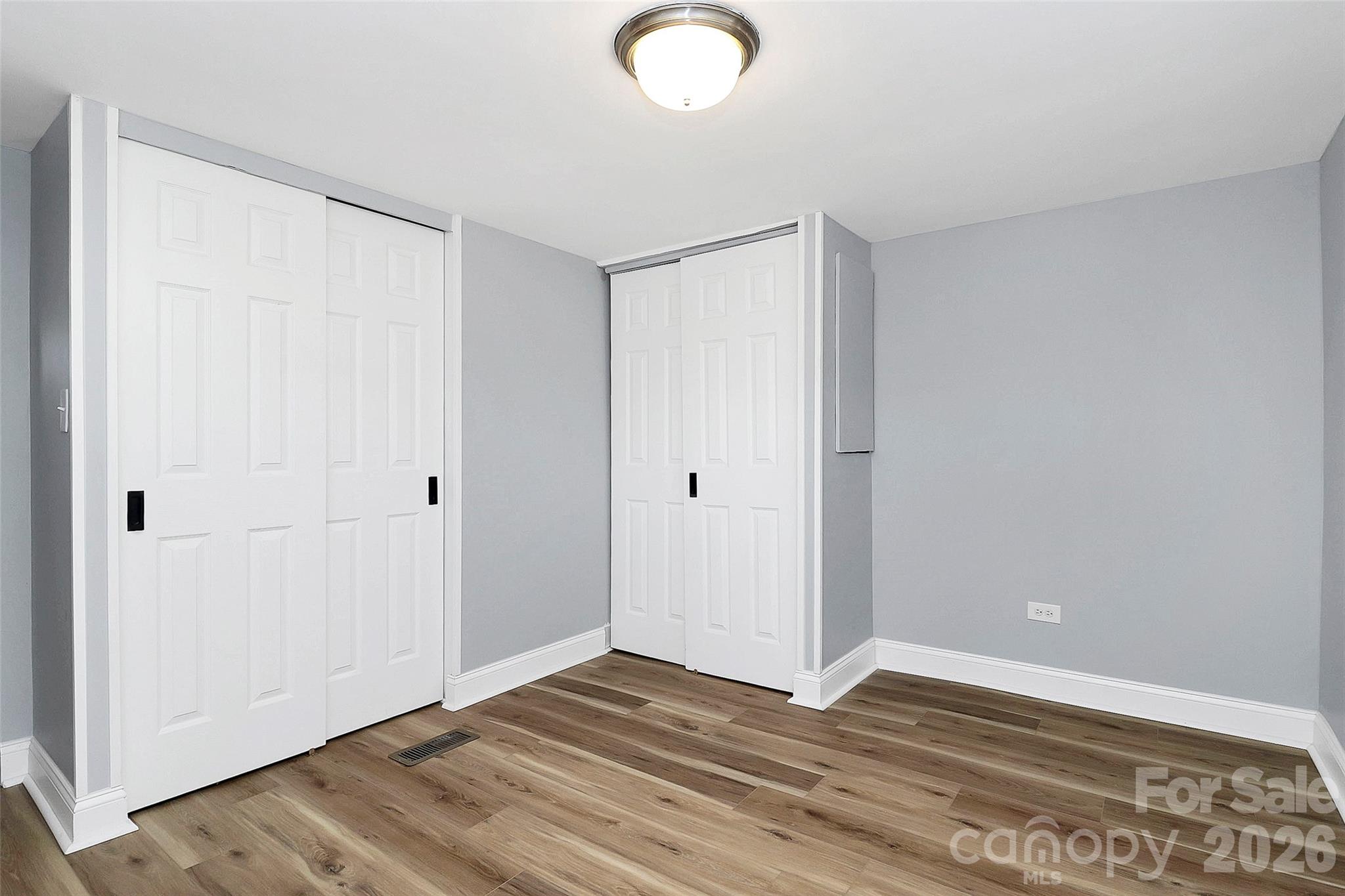 146 Swink Street Southwest Concord, NC 28027 - Photo 22 of 35 a view of an empty room with wooden floor