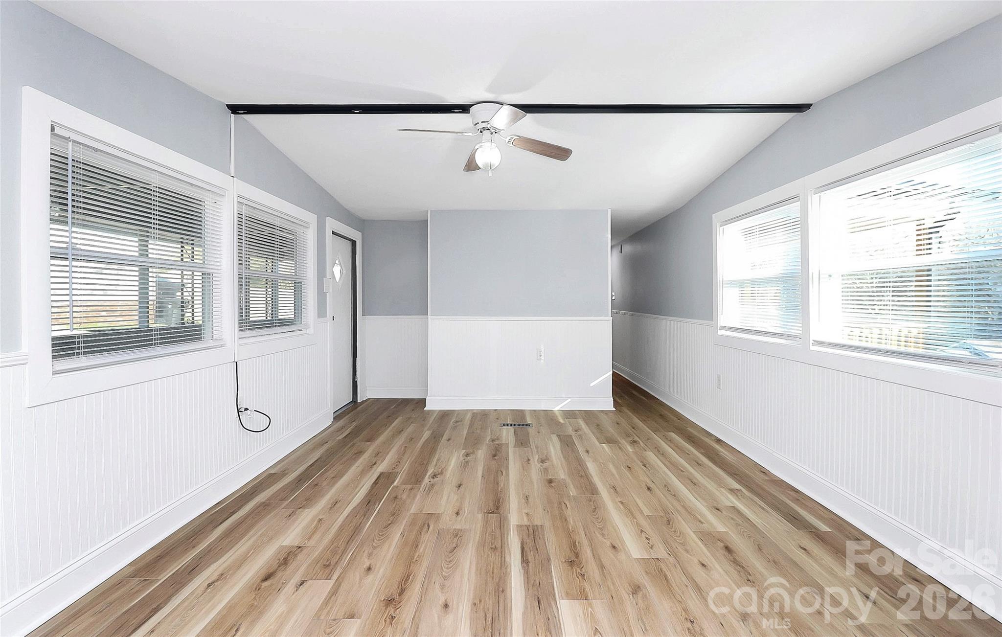 146 Swink Street Southwest Concord, NC 28027 - Photo 5 of 35 wooden floor in an empty room with a window